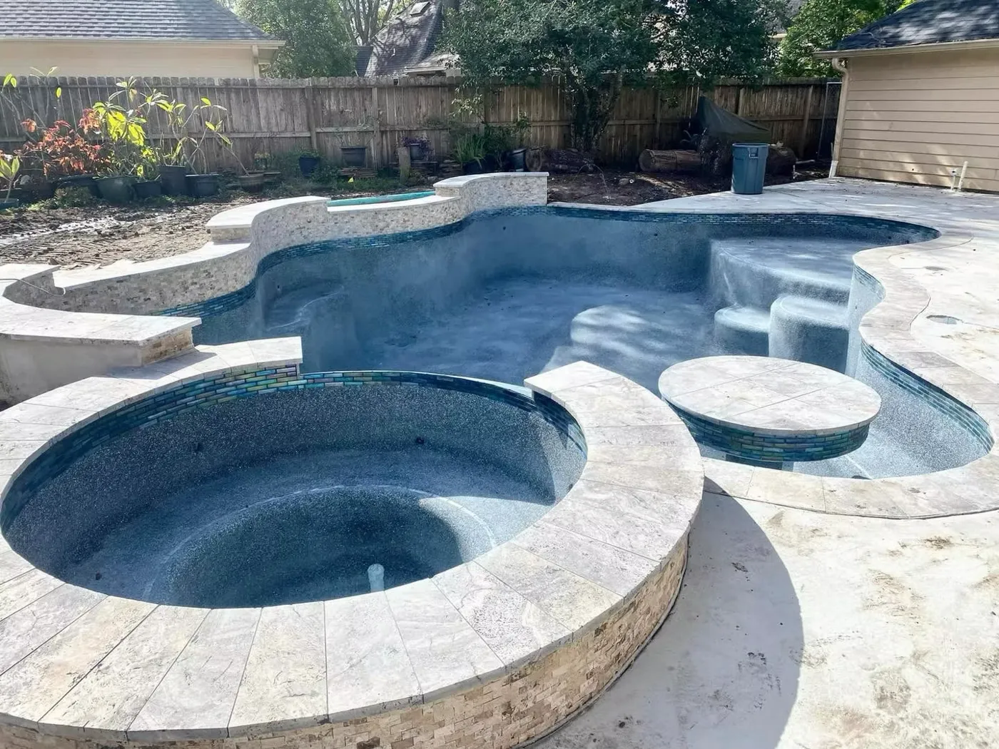 Freeform pool with round spa