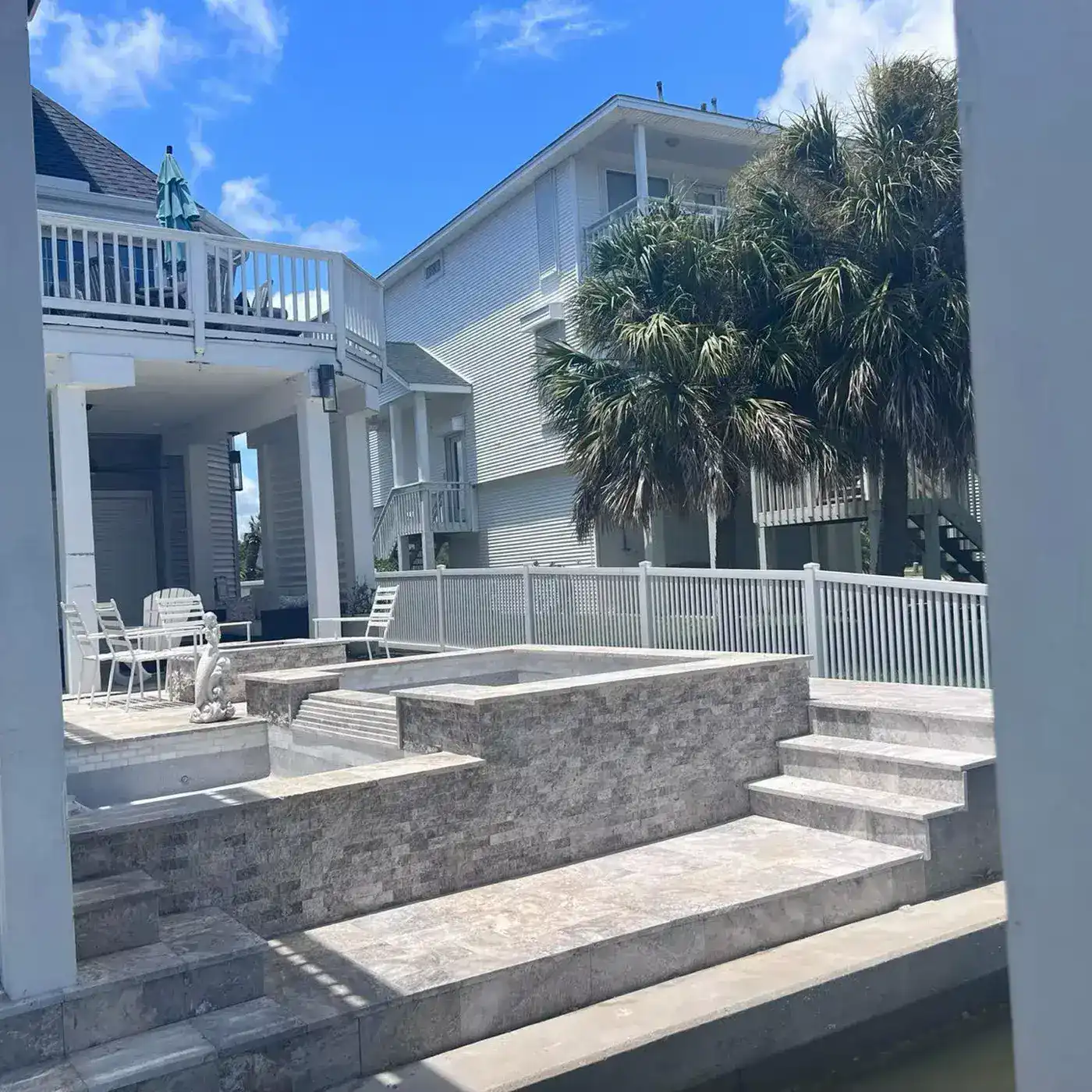 Coastal-style pool with stone deck
